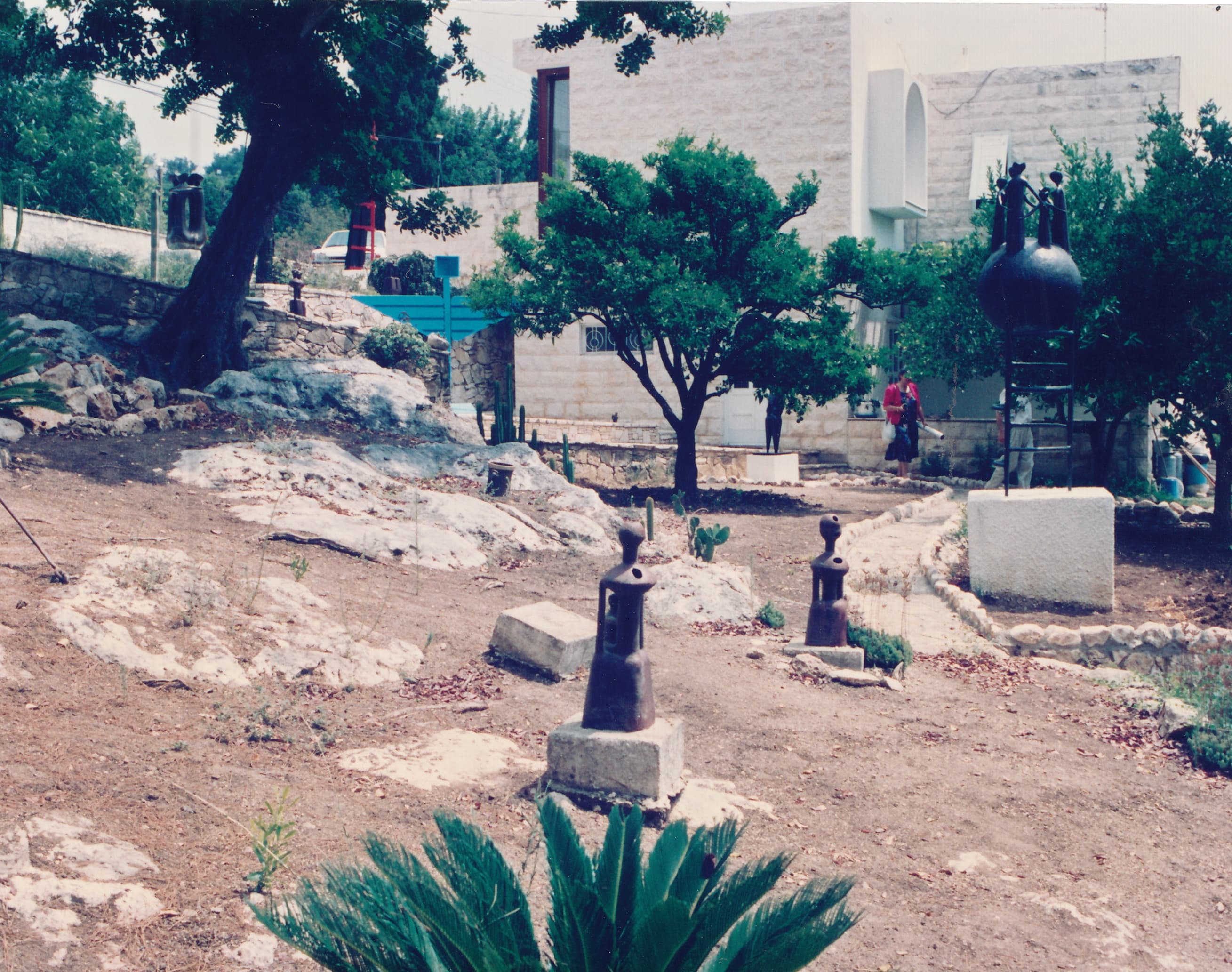 The Ein Hod artists' village — bronze sculptures among stone houses and Mediterranean trees